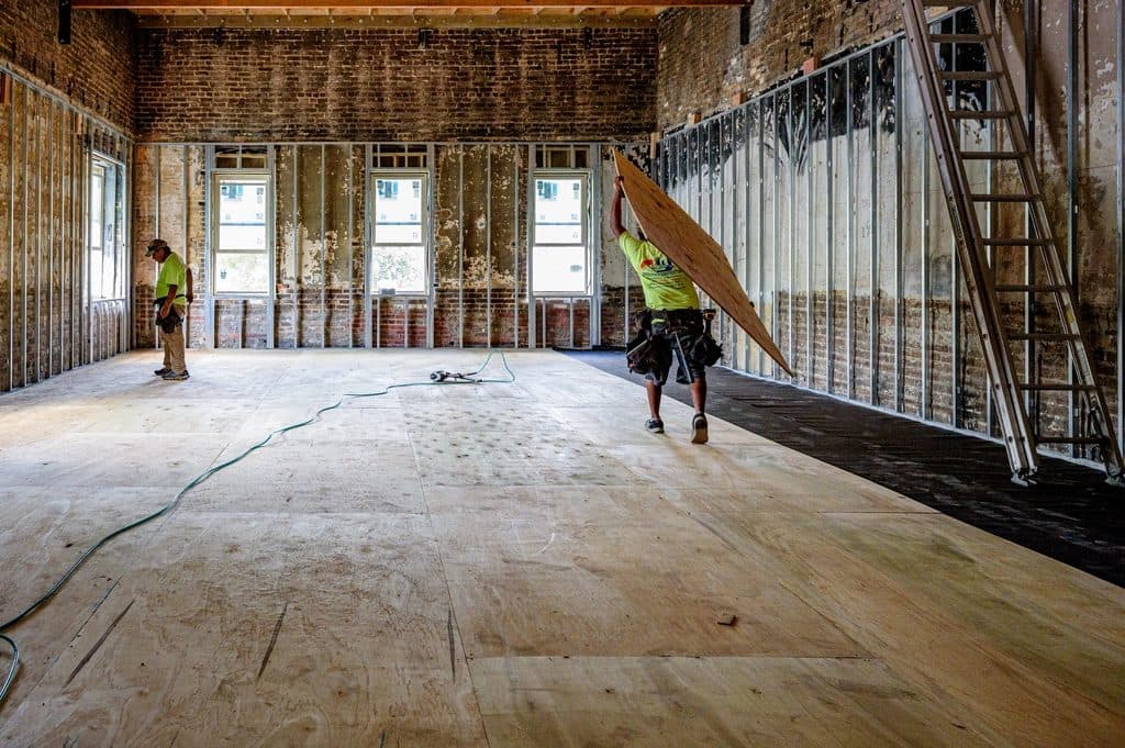 Builders stripping back and refitting a house interior